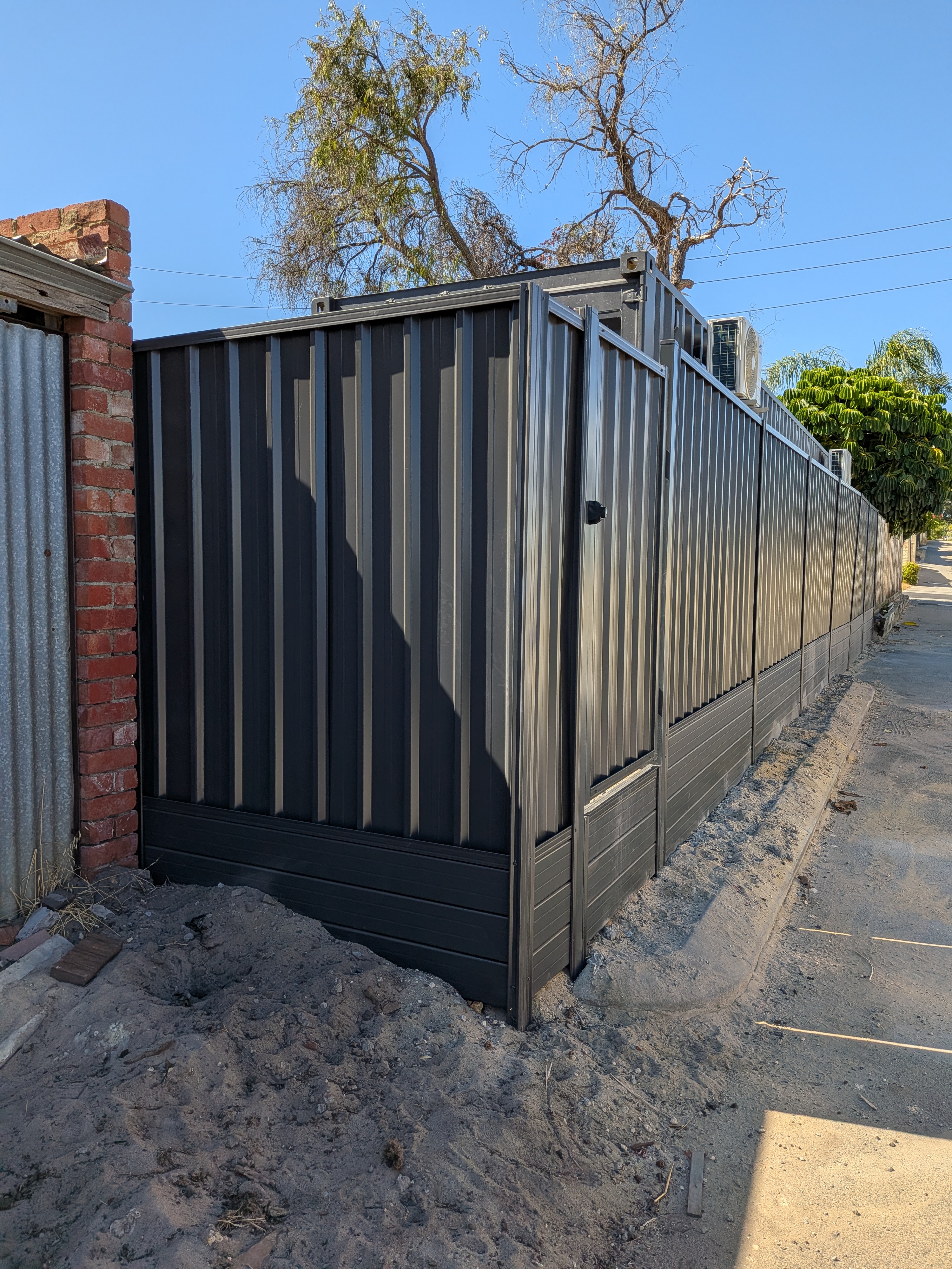 Monument Colorbond fence panels and posts installed neatly